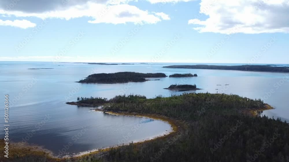 HD Drone Aerial Over Atlantic Ocean Cove overlooking Island Seaside Landscape in Beautiful Scenic Nova Scotia Tourism Destination Voyage