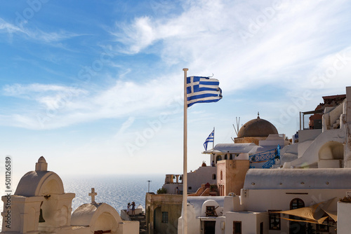 Greece flag over old greek town.