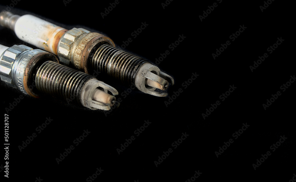 Old automobile glow plugs with a large output and chips. Car service at a car service Old automobile glow plugs with a large output and chips. Car service at a car service