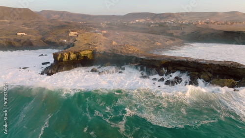 Top view of the Atlantic ocean crash the rocks of Punta Guadalupe .