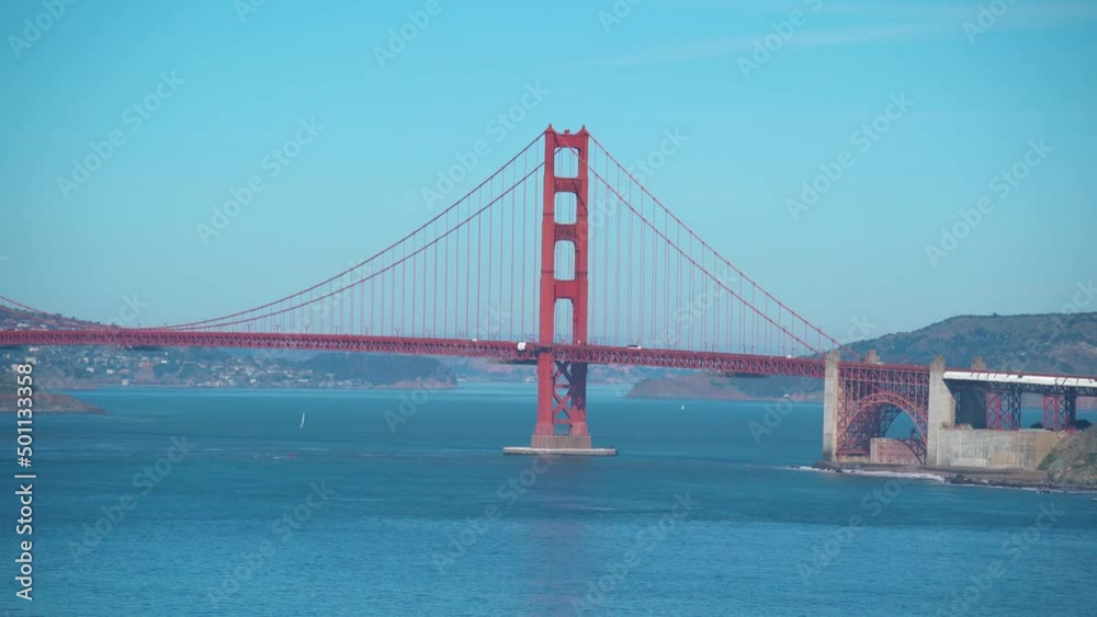 Wide shot of cars driving on Golden Gate Bridge connecting Marin County and Napa Valley Wide shot of cars driving on Golden Gate Bridge connecting Marin County and Napa Valley