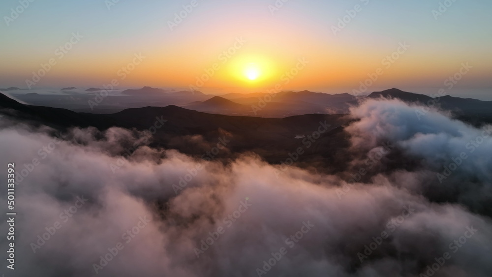 Obraz premium Top view of the sunrise over the mountains. Aerial view of Fuerteventura