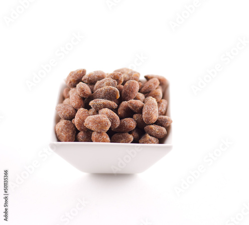 Bowl of Candied Almonds on a White Background