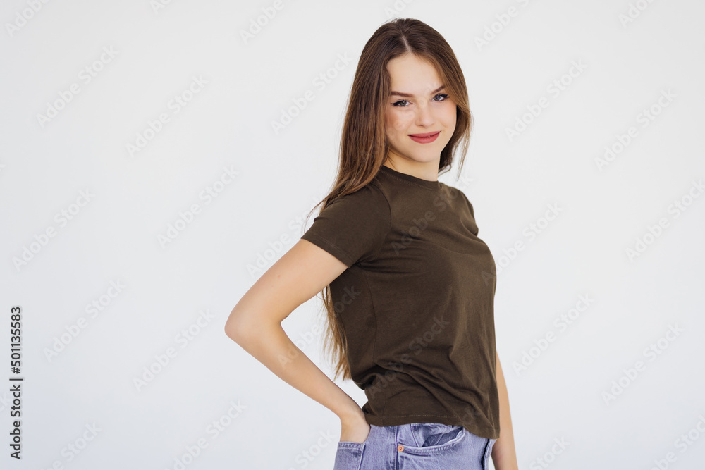Smiling brunette woman looking at the camera over white background Smiling brunette woman looking at the camera over white background