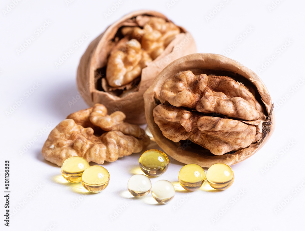 Ripe walnuts and capsules with a vitamin Ripe walnuts and capsules with a vitamin