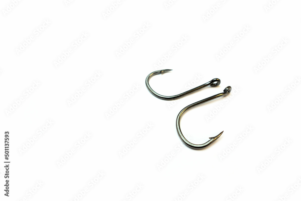 Fishing hooks on a white background. Isolated object. Fishing gear. Fishing hooks on a white background. Isolated object. Fishing gear.