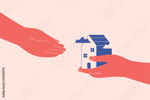 One hand gives to another hand small house. Provision of help and shelter to person in need. Concept of the safe place. Acquisition of ownership or rental of property. Vector concept photo