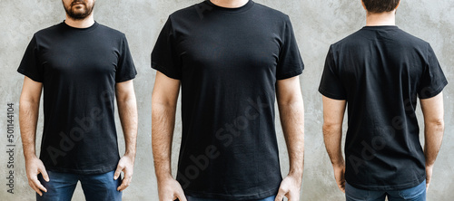 Young man with a beard in an empty black casual t-shirt. Front, close-up and rear view on a light gray concrete wall. Design and layout of men's t-shirt for printing.