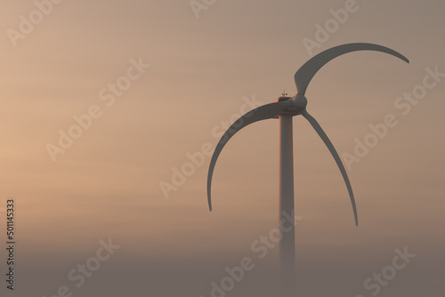 The uselessness of a wind turbine during calm weather photo