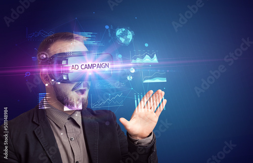 Businessman looking through Virtual Reality glasses