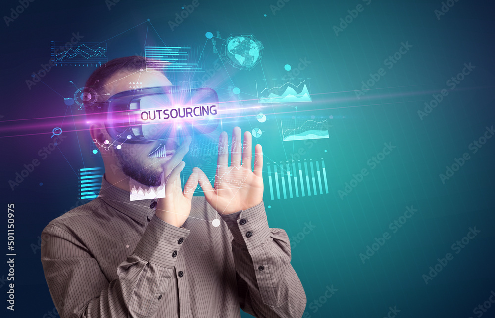 Businessman looking through Virtual Reality glasses Businessman looking through Virtual Reality glasses