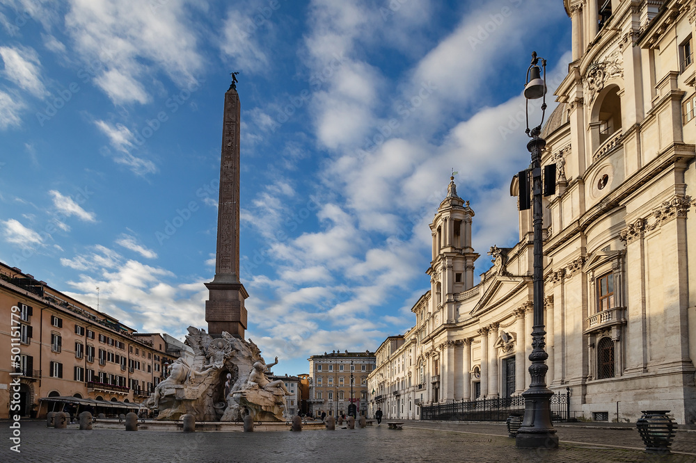 Piazza Navona with The Fountain of Four Rivers (Fontana dei Quattro Fiumi) and Church of Saint Agnes. Rome, Italy.