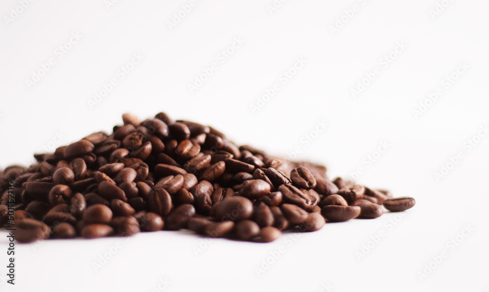 A heap of coffee beans on white A heap of coffee beans on white
