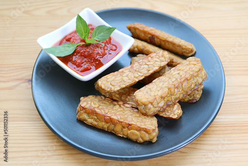 Pan fried Tempeh with homemade marinara sauce, an easy and tasty dish of whole foods plant-based diet