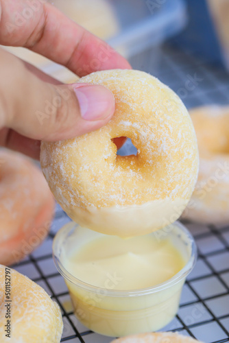 A round Japanese homemade doughnut or Bomboloni, sweet bakery prepared for fried with hot oil.