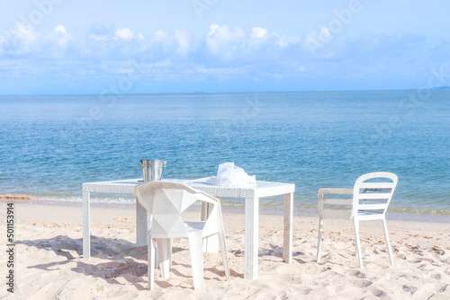 White tables by the sea, seaside cafes in Thailand © sai
