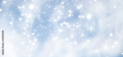 blue snowfall bokeh background, abstract snowflake background on blurred abstract blue © alexkich