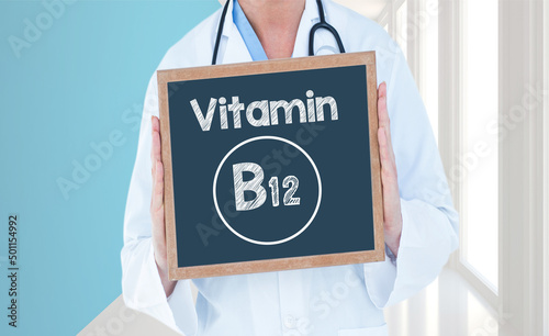 Vitamin B12 - Doctor shows information on blackboard.Doctor holding chalkboard with text.