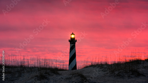 Red morning skies over Cape Hatteras Light House along the Outer Banks of North Carolina photo