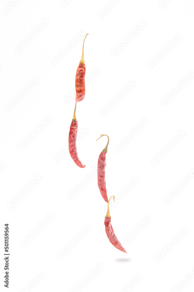 Chili pepper falling isolated on white background. Ripe chili pepper Clipping Path Chili pepper falling isolated on white background. Ripe chili pepper Clipping Path