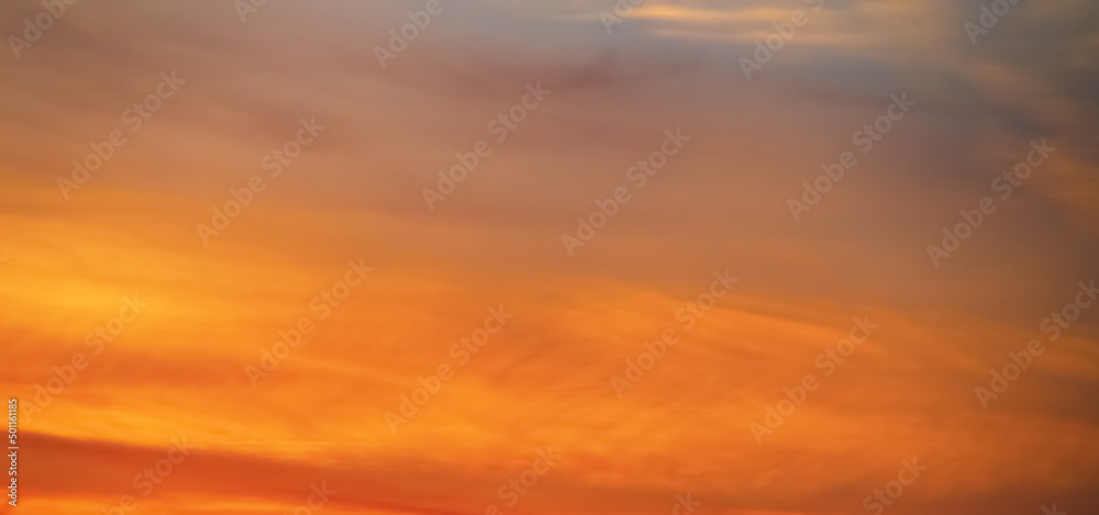 Sunset sky. Background with orange clouds at sunset