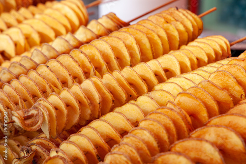 grilled potatoes, peeled and cooked at fairs and markets photo