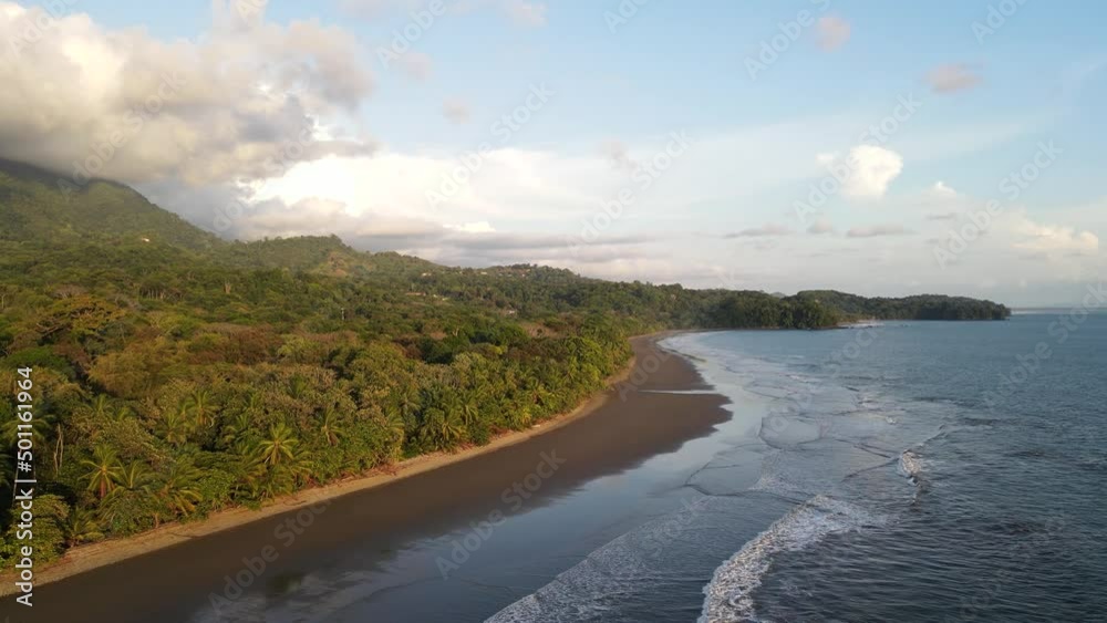 Drone, Moving In across Sandy beaches, with tropical forest and mountains Drone, Moving In across Sandy beaches, with tropical forest and mountains