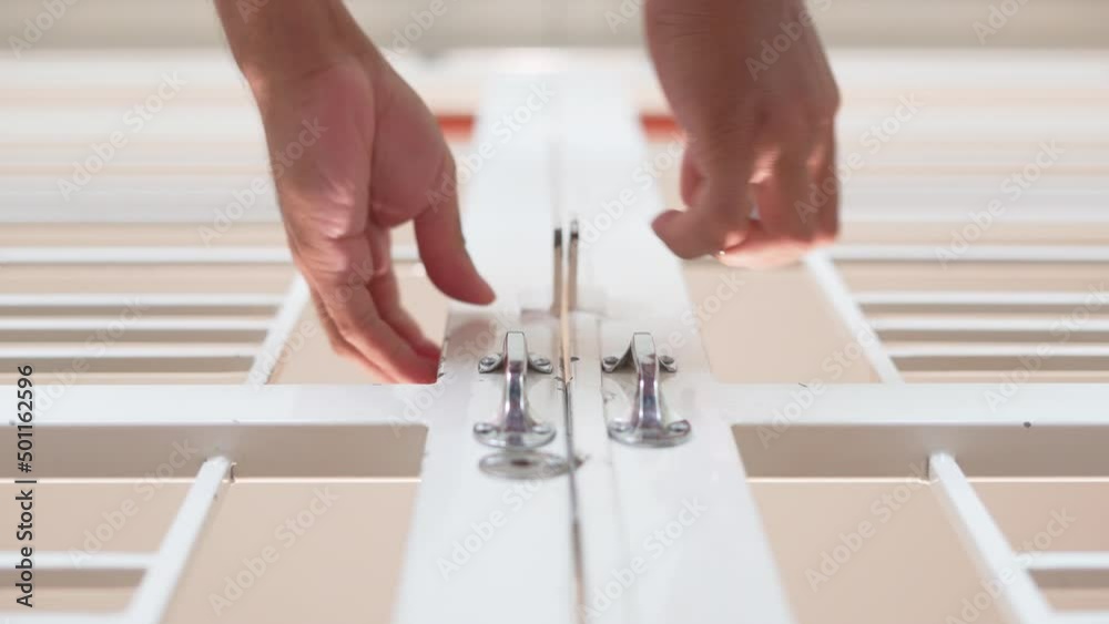 Lock hangs with key chain padlock bolt white door home. Lock hangs with key chain padlock bolt white door home.