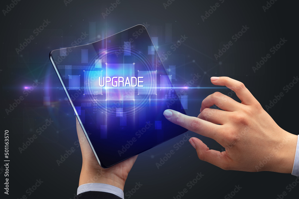 Businessman holding a foldable smartphone Businessman holding a foldable smartphone