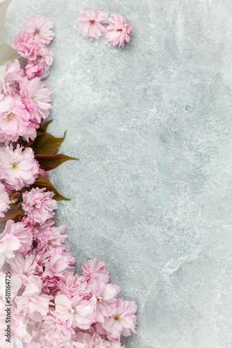 Pink Flowers on Grey Cement Background for Product Mock Up, Product Display, Copy Space product photo