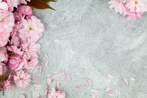 Pink Flowers on Grey Cement Background for Product Mock Up, Product Display, Copy Space product photo