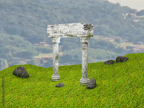 Ancient columns in ruins over field