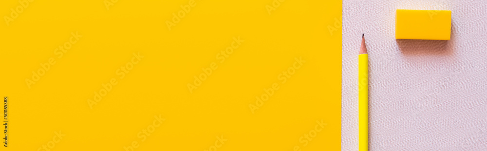 top view of pencil near eraser on white and yellow, banner. - obrazy, fototapety, plakaty 