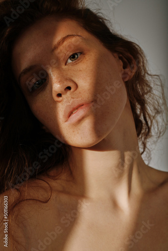 Cuadro en lienzo Portrait of young girl with red hair having natural beauty posing at camera with