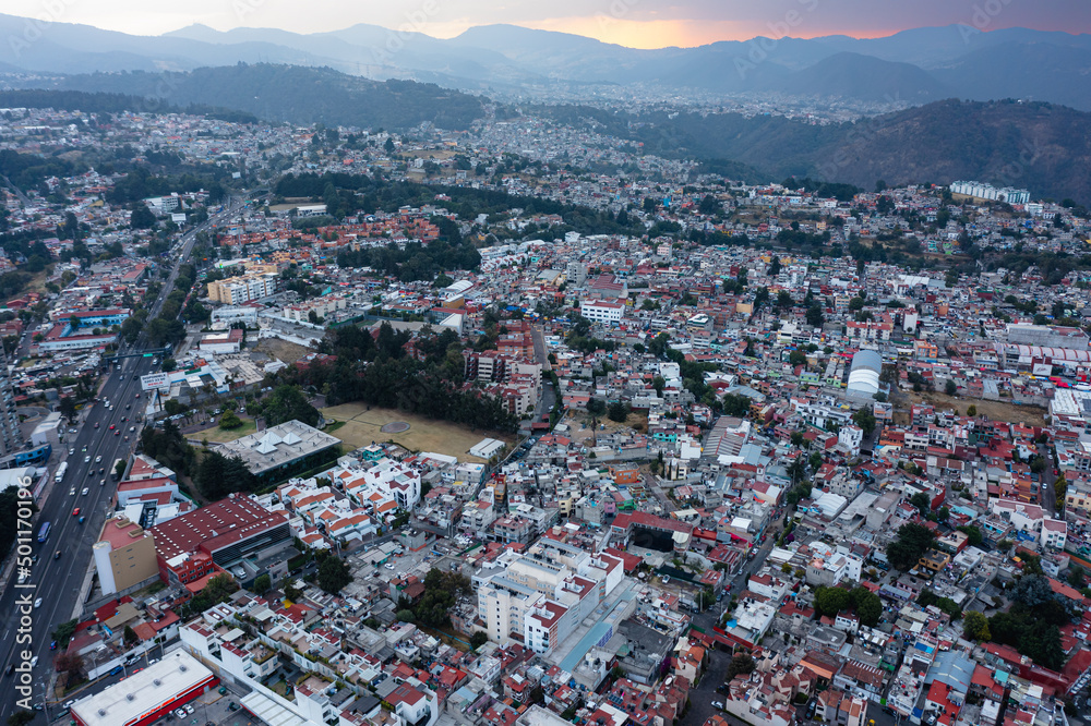View from the air of Cuajimalpa on the outskirts of Mexico City, the mountains and their surroundings at sunset