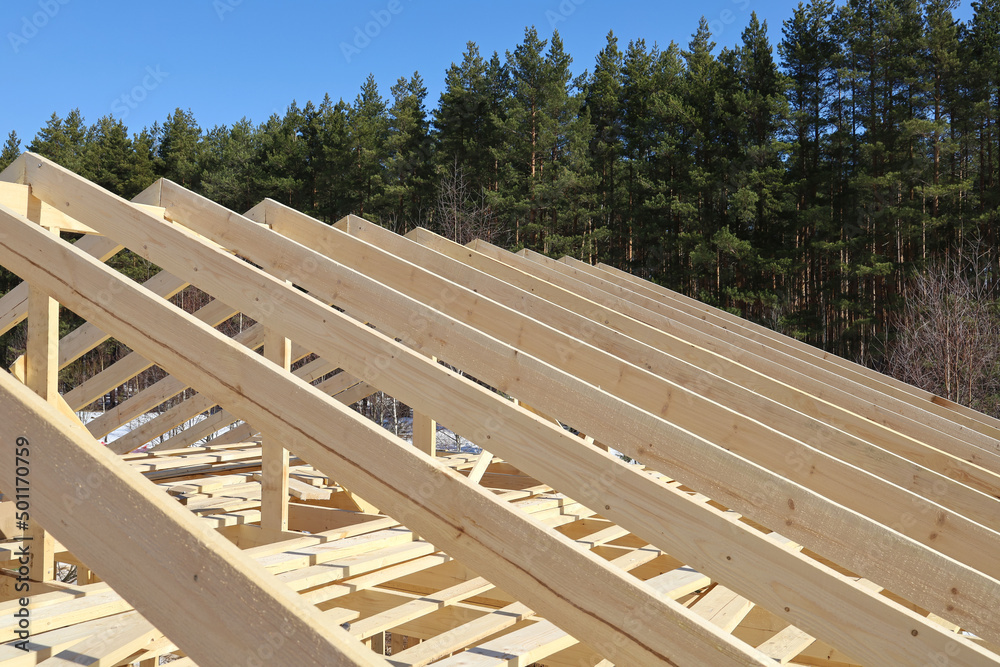 Wooden rafters of roofs, construction of frame house in rural areas ...
