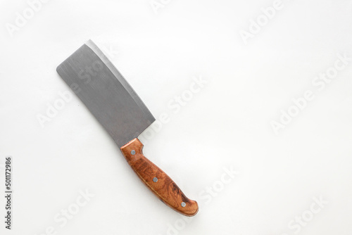 Chef's kitchen knife on white background. Top view. Free space for your text. Creative layout. Chef, restaurant or kitchen concept.