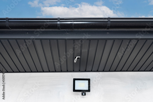 Принти на полотні A modern graphite roof lining is attached to the trusses, visible cables and holes for LED lights