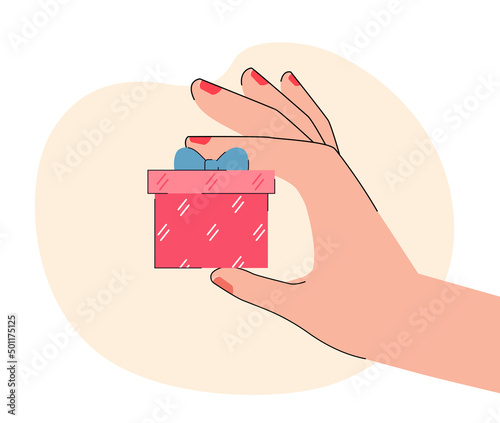 Hand holding surprise gift box with bow. Person giving wrapped present on festive event flat vector illustration. Referral bonus, giveaway concept for banner, website design or landing web page