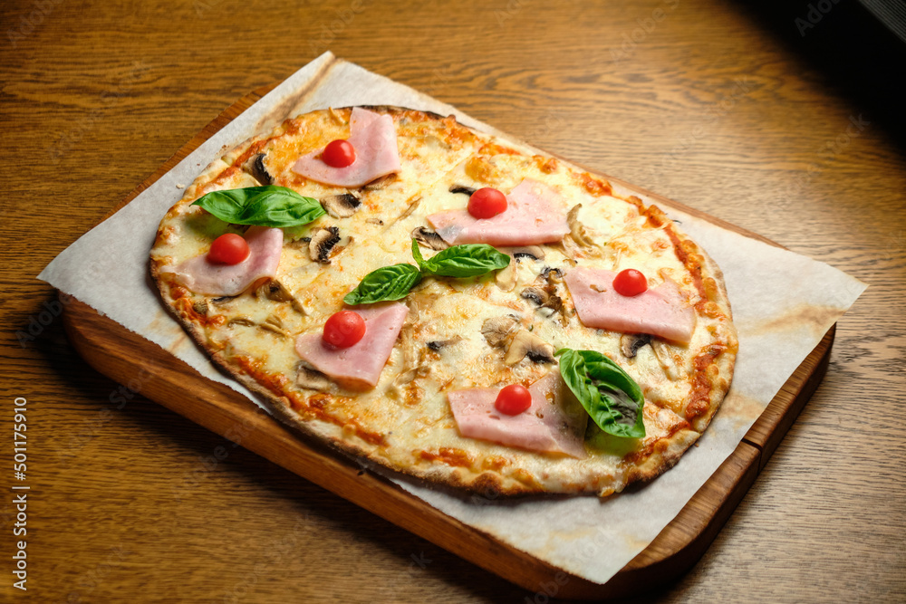 Pizza with bacon and ham and tomatoes Pizza with bacon and ham and tomatoes