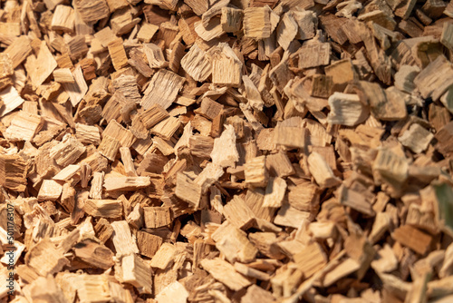 Beige wood chips for smoking. Chopped wood close-up. Wood texture or background