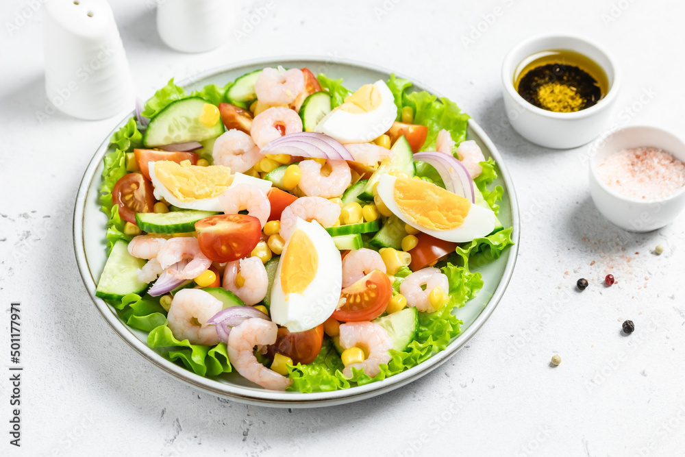 Shrimp egg salad salad on plate on light background. Copy space. Shrimp egg salad salad on plate on light background. Copy space.