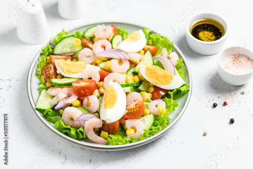 Shrimp egg salad salad on plate on light background. Copy space.