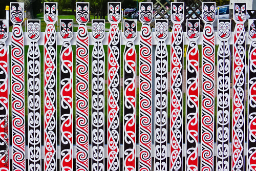 Wood fence decorated with Māori art patterns rotorua New Zealand 