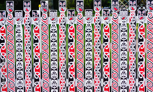 Wood fence decorated with Māori art patterns rotorua New Zealand 