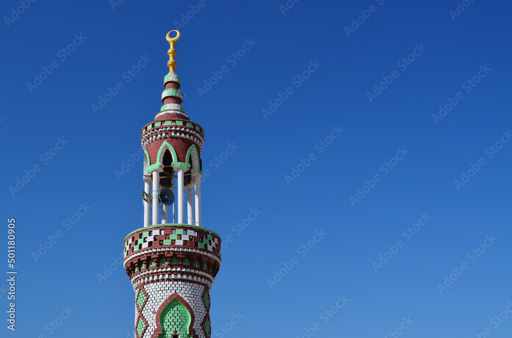 A mosque minaret in the clear blue sky background. Sinai peninsula, Egypt.