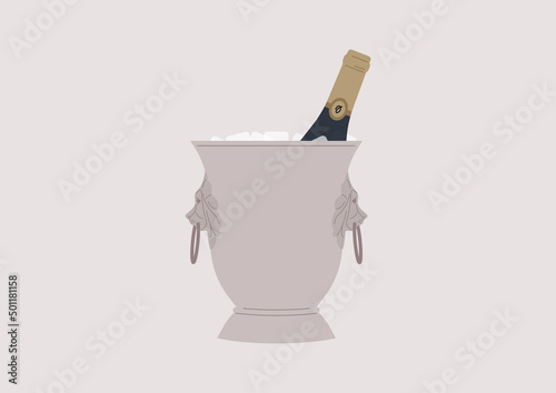 An ice bucket with lion heads and a bottle of champagne inside, a celebration event