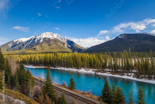 Fototapeta Naklejka Na Ścianę i Meble -  Blue River Flowing Through Banff Mountains