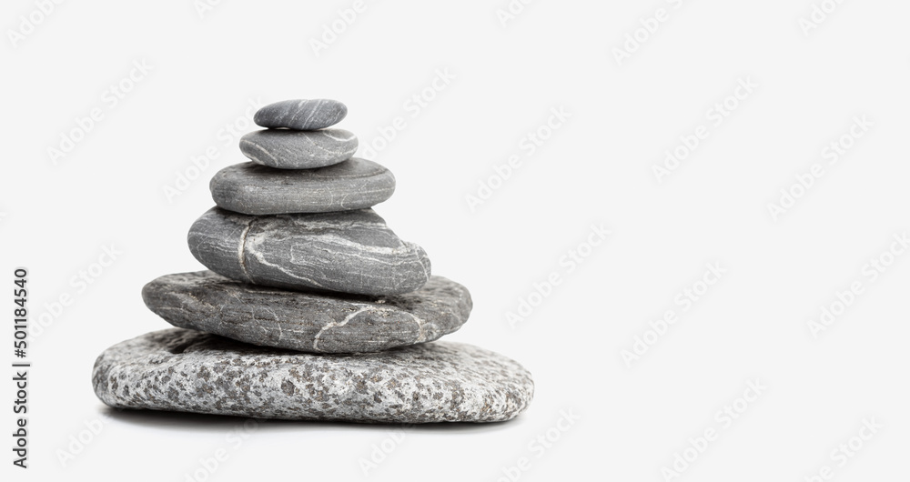 Balanced Stones isolated on white background with copy space. Balancing Pebbles. Life balance and harmony concept Balanced Stones isolated on white background with copy space. Balancing Pebbles. Life balance and harmony concept