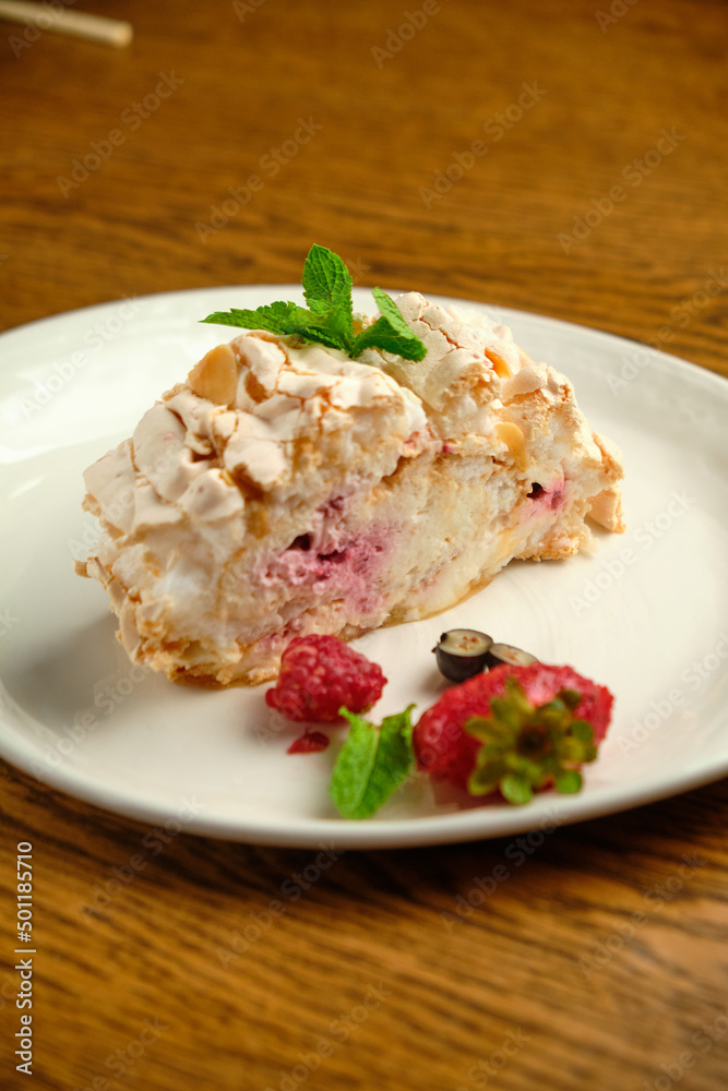 Cake with meringue roll with cream and raspberries Cake with meringue roll with cream and raspberries